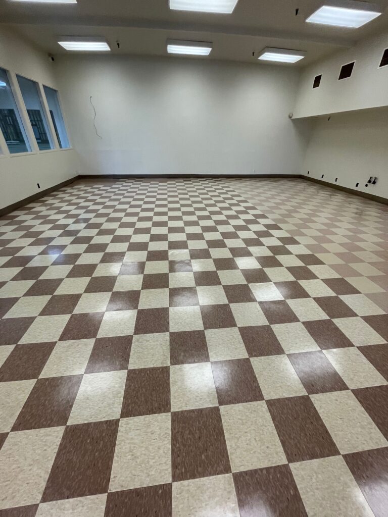 Gleaming waxed floor showcasing the impeccable results of professional strip and wax services.