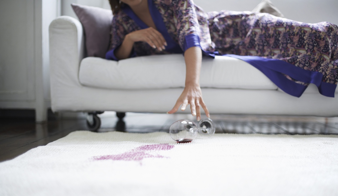 Spilled red wine on a white carpet in a Carmel Valley home.