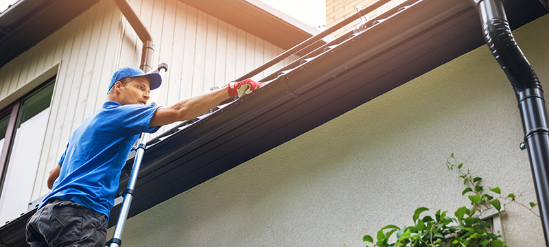 Gutter cleaner servicing a home in Carmel Valley.